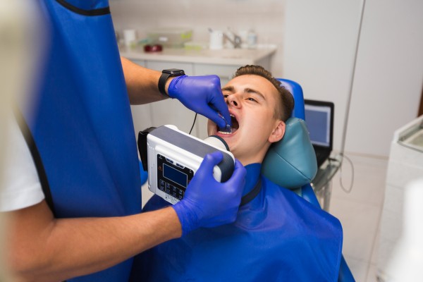 photo dental procedure on patient by dentist