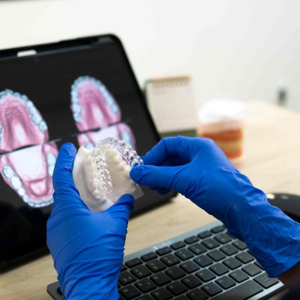 Dentist using digital smile design technology with clear aligners at Luna Dental Astoria
